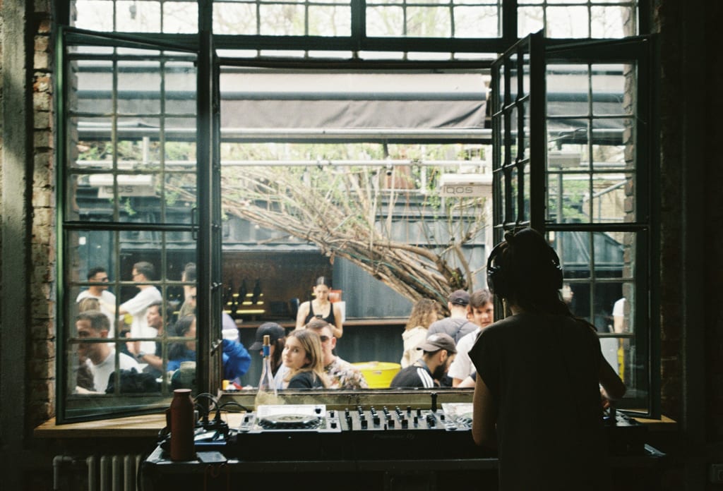 DJ by window at cafe